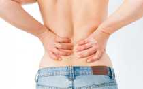 Почему болит под ребрами на спине